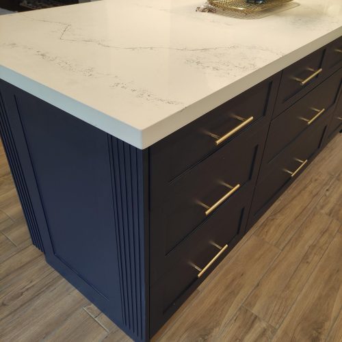 custom kitchen cabinet Canada with a detailed view of a kitchen island and gold drawer handles