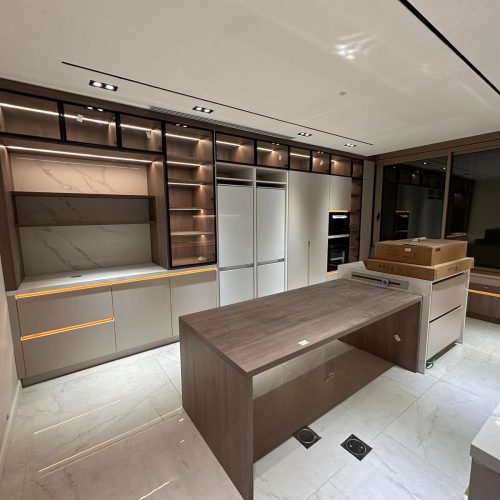 Kitchen with high-end custom kitchen cabinets and lighting in Palestine custom cabinet project.