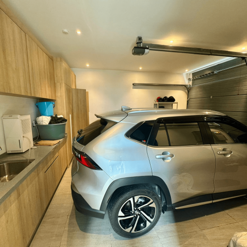 Custom garage cabinet in a Bali home project, showcasing modern storage design.