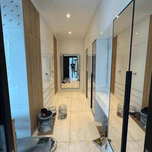 Hallway with custom cabinets in a Bali home project, offering style and utility.