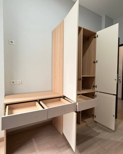 Indonesia Rental Apartment Renovation Custom Furniture Project 2 Two-tone custom wardrobe with built-in desk and opened cabinet doors in Indonesia rental apartment.