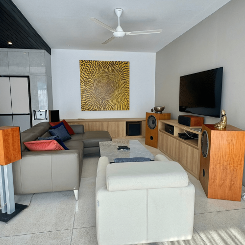 Spacious living room with modern furniture and large windows, part of Bali project.