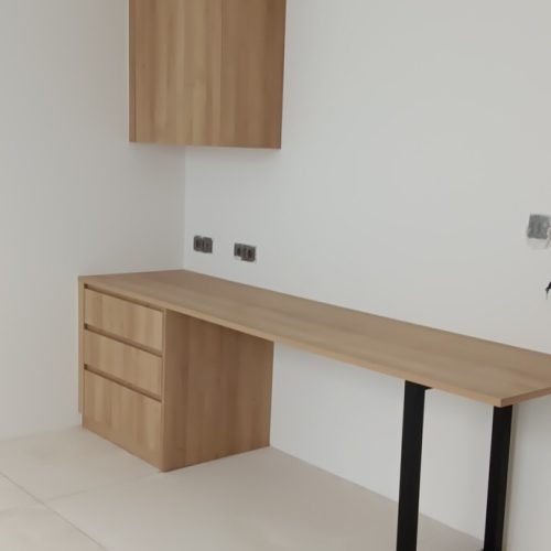 Custom-made desk with wooden finish in a Bali project bedroom.