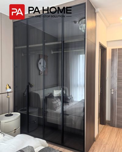 Elegant Tangerang Whole House Custom Interior Project 4 Tangerang bedroom with custom glass door wardrobe, wood frame, dark glass panels, and modern storage.
