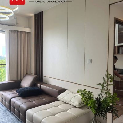 Elegant Tangerang Whole House Custom Interior Project 8 Tangerang living room with custom wall panels, decorative lighting, sofa area, and modern interior design.
