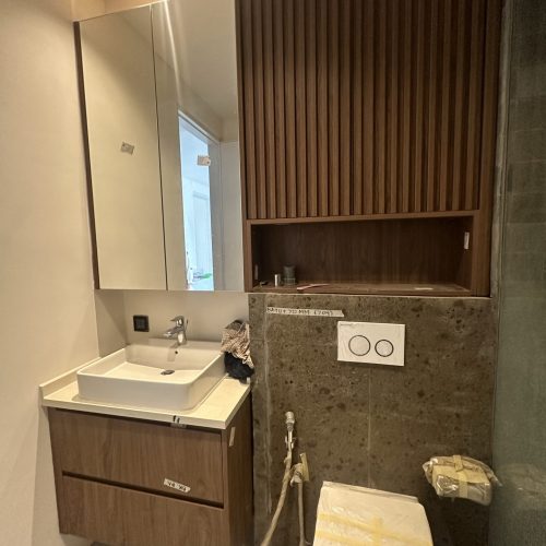 Umalas Creek Villa Custom Cabinets Project bathroom vanity with undermount sink dark wood cabinets and mirrored medicine cabinet