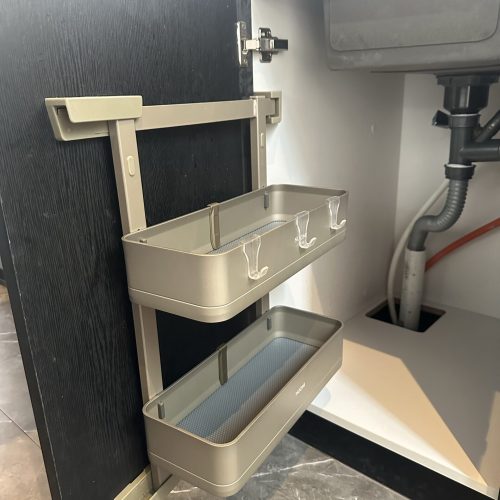 Umalas Creek Villa Custom Cabinets Project under sink pull out organizer with two metal trays and hooks