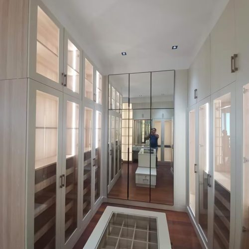 Whole House Custom in Philippines 7 Custom walk-in closet with wooden shelves and lighting, part of Whole House Custom in Philippines.